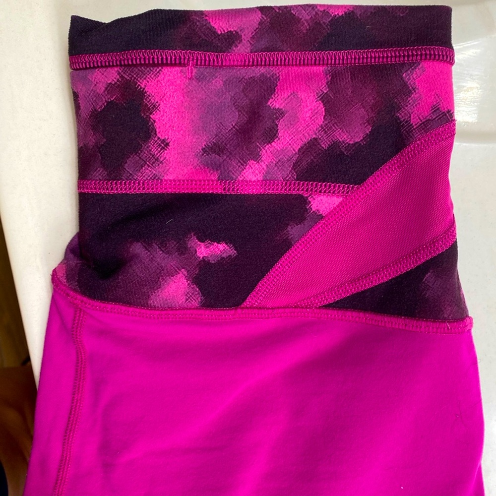 Lulu. pink and black crop leggings. Inseam 21”. Waist 13”. Key pocket.